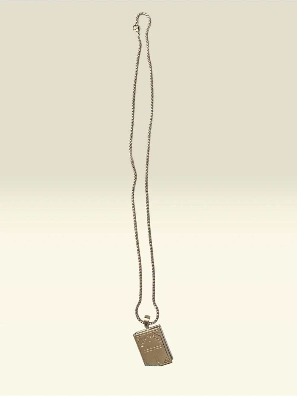 The Lord’s Prayer engraved locket and The Lord’s Prayer engraved ring. Stainless